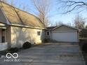 The home features a two-car detached garage and extra driveway parking space at 929 Gilbert Ave, Indianapolis, IN 46227