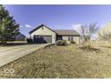 Charming single-story home featuring a two-car garage, landscaped front yard, and neutral siding at 954 W Palomino Pl, Bargersville, IN 46106
