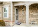 Close-up of the home's front entrance, showing a covered porch and stone detailing at 112 Bridgemor Ln, Mooresville, IN 46158