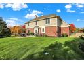 Lovely backyard featuring a patio area for entertaining and manicured lawn at 11573 Westbury Pl Dr, Carmel, IN 46032