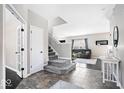 Elegant entryway with beautiful tile flooring, staircase and a view to the living room at 11835 Bengals Dr, Fishers, IN 46037