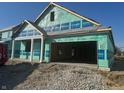 New construction home with a large two-car garage and a covered front porch at 1366 Foxtail Ln, Greenwood, IN 46143
