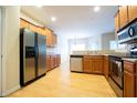 Well-equipped kitchen with stainless steel appliances and maple cabinets at 1502 Heron Ridge Blvd, Greenwood, IN 46143