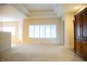 Bright, open living room with coffered ceilings and natural light at 1502 Heron Ridge Blvd, Greenwood, IN 46143