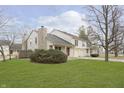 A well-maintained, inviting two-story home with lush lawn and attached two-car garage at 2619 Chaseway Ct, Indianapolis, IN 46268