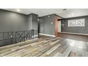 Open-concept living area featuring hardwood floors and modern gray walls at 4249 Dubarry Rd, Indianapolis, IN 46226