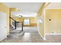 Foyer boasts tile floors and staircase leading to the upper level, adjacent to a Gathering room at 4323 Elkhorn Dr, Westfield, IN 46062