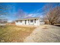 Cozy single-Gathering home with manicured lawn, gravel driveway, and inviting front porch at 540 Barnett Ct, Whiteland, IN 46184