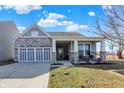 Charming single-Gathering home with stone accents, covered porch, and two-car garage at 5751 Bluff View Ln, Whitestown, IN 46075