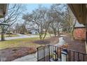 Cozy front porch view with a stone pathway and lush landscaping at 605 Sugarbush Dr, Zionsville, IN 46077