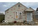 Charming exterior showcasing the home's stone facade and covered entryway at 714 S Biltmore Ave, Indianapolis, IN 46241