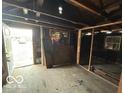 Interior room featuring exposed framing and outdoor access at 714 S Biltmore Ave, Indianapolis, IN 46241