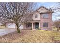 Beautiful two-story brick home with well-maintained lawn and mature trees at 8333 Hunters Meadow Ct, Indianapolis, IN 46259