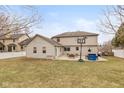 Spacious backyard with green grass, a patio with outdoor seating, perfect for entertaining at 1023 N Quiet Bay Cir, Cicero, IN 46034