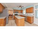 Bright kitchen featuring wooden cabinets, stainless steel appliances, and a center island at 1023 N Quiet Bay Cir, Cicero, IN 46034