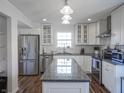 Modern kitchen with stainless steel appliances, granite countertops, and an island at 10920 Gate Cir, Fishers, IN 46038