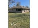 Brick home with a screened in porch and spacious backyard at 1103 Charleston Commons Dr, Anderson, IN 46012