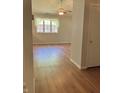 Bedroom with hardwood flooring and a window overlooking the backyard at 1103 Charleston Commons Dr, Anderson, IN 46012
