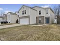 Inviting home exterior with attached two-car garage and concrete driveway at 11614 Presidio Dr, Indianapolis, IN 46235