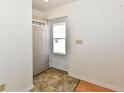 Bright entryway with tiled flooring and a white front door leading to the home's exterior at 1507 Park Dr, Lebanon, IN 46052