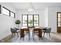 Dining room with wood table, stylish chairs, and modern lighting at 1526 Laurel St, Indianapolis, IN 46203