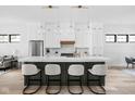 Modern kitchen featuring an island with bar seating, stainless steel appliances and pendant lighting at 1526 Laurel St, Indianapolis, IN 46203