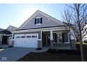Beautiful single-Gathering home with a two-car garage and a well-manicured lawn at 16771 Cattle Hollow Ln, Noblesville, IN 46060