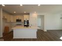 Well-lit kitchen with an island, stainless steel appliances and shaker cabinets at 16771 Cattle Hollow Ln, Noblesville, IN 46060
