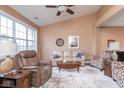 Comfortable living room featuring neutral walls, wood floors, ceiling fan and a large window at 18357 Piers End Dr, Noblesville, IN 46062