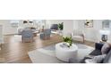 Bright and airy living room with stylish furniture, modern decor, and beautiful flooring at 1854 Cascades Dr, Greenfield, IN 46140