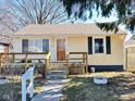 Cozy single-story house featuring a walkway, porch, and quaint curb appeal at 2523 S Mcclure St, Indianapolis, IN 46241