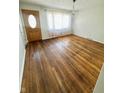 Inviting living room with polished hardwood floors and a decorative chandelier at 2523 S Mcclure St, Indianapolis, IN 46241