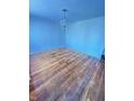 Spacious living room featuring hardwood floors and neutral-colored walls at 2523 S Mcclure St, Indianapolis, IN 46241