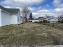 Spacious fenced backyard with a well-maintained lawn and ample space for outdoor activities at 2712 S A St, Elwood, IN 46036