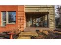 Cozy front porch with seating and classic brick facade, perfect for relaxing and enjoying the outdoors at 304 E 17Th St, Indianapolis, IN 46202