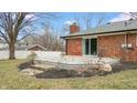 Wooden deck with stone steps off of sliding glass doors with a view of the backyard at 3779 W County Line Rd, Greenwood, IN 46142