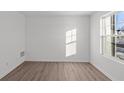 A bright room showcasing wood-look flooring, clean lines, and natural lighting at 7062 Nine Penny Dr, Brownsburg, IN 46112