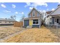 Charming home with a yellow front door and freshly mulched yard at 714 S Keystone Ave, Indianapolis, IN 46203