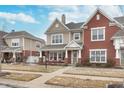 Inviting townhouse with a cozy porch and well-maintained landscaping in a desirable neighborhood at 1225 Middlebury Dr, Westfield, IN 46074