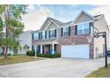 Spacious two-story home with brick and vinyl siding, well-manicured lawn, and an attached two-car garage with basketball hoop at 1288 Ivory Ct, Greenwood, IN 46143