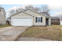 Charming single-story home with vinyl siding, a well-manicured lawn, and an attached one car garage at 13446 N Carwood Ct, Camby, IN 46113