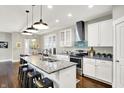 Eat-in kitchen with granite countertops, stainless steel appliances, and modern pendant lighting at 1422 Carrollton Ave, Indianapolis, IN 46202