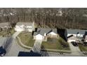 An aerial view shows the house in a suburban neighborhood with mature trees and well-maintained lawns at 17051 Rainier Cir, Westfield, IN 46062