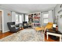 Comfortable living room with hardwood floors, an area rug, and lots of natural light at 19 Orchard Ln, Anderson, IN 46011