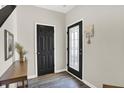 Bright entryway featuring stylish wood floors, decorative glass door, and convenient mail organizer at 3423 Shadow Bend Dr, Columbus, IN 47201