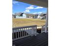 Street view from the front porch with a mix of home styles and well-kept lawns at 5421 Upper Garden Way, Zionsville, IN 46077