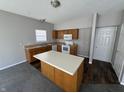 Bright kitchen with wood cabinets, modern appliances, and a convenient center island at 5816 Dollar Forge Dr, Indianapolis, IN 46221