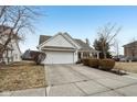 Charming home featuring a well-manicured lawn, attached garage, and a welcoming front porch at 780 Pawtucket Dr, Westfield, IN 46074