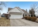 Charming home featuring a well-manicured lawn, attached garage, and a welcoming front porch at 780 Pawtucket Dr, Westfield, IN 46074