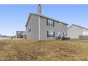 Well-maintained backyard with a grassy lawn and a view of the neighboring homes at 8193 Cagles Mill Trce, Avon, IN 46123